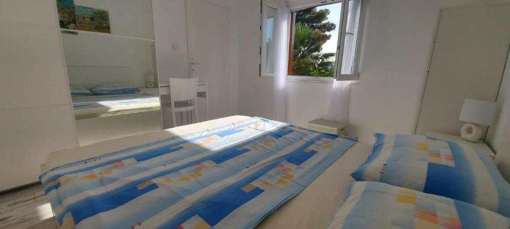 Postel nebo postele na pokoji v ubytování Apartment CONTE