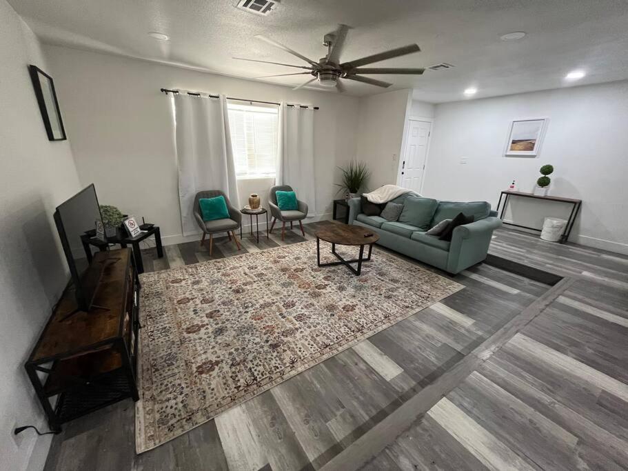 a living room with a couch and a rug at 3Bedroom 2Bath 15 Min to strip 10 downtown in Las Vegas