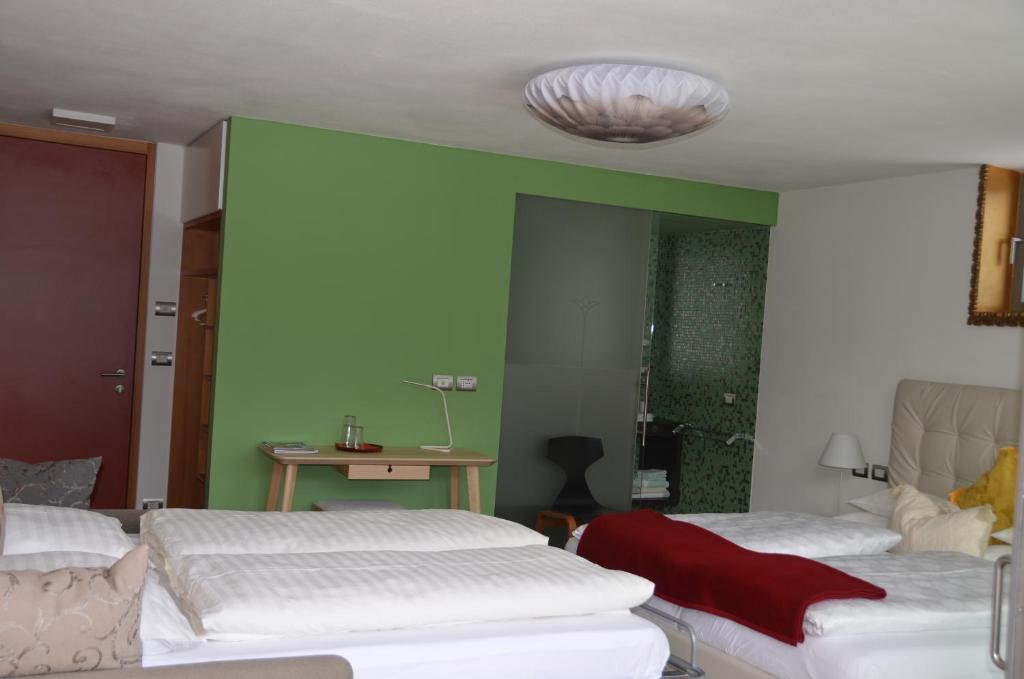 Łóżko lub łóżka w pokoju w obiekcie Fior Tamion