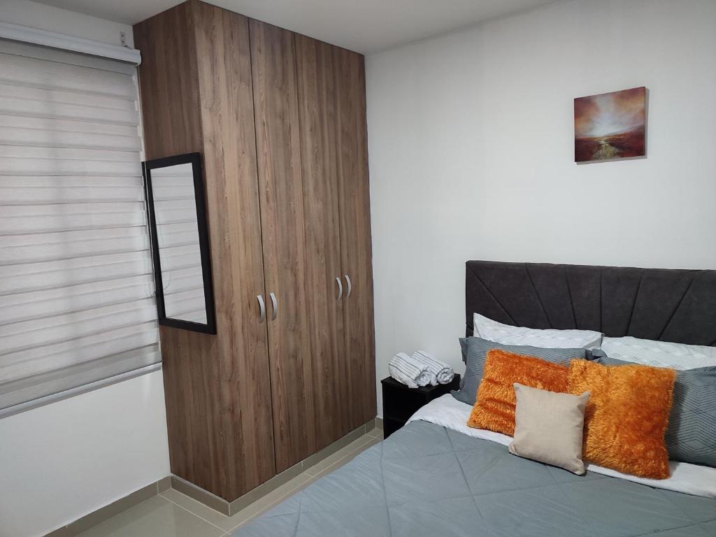 Letto o letti in una camera di 302-Cómodo y moderno apartamento de 2 habitaciones en la mejor zona céntrica de Ibagué