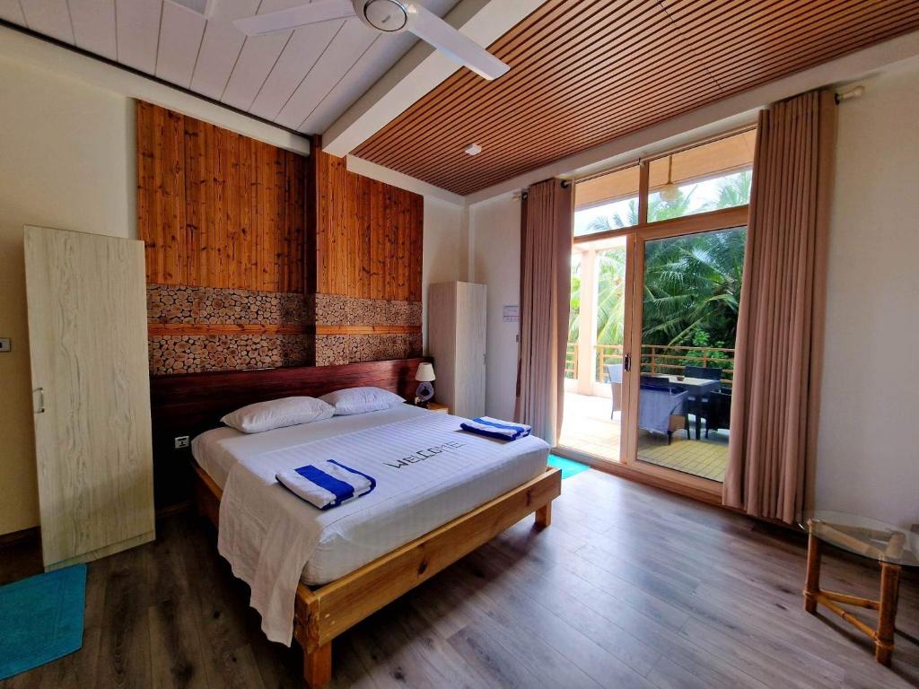 Lova arba lovos apgyvendinimo įstaigoje Finolhu Beach Guest House