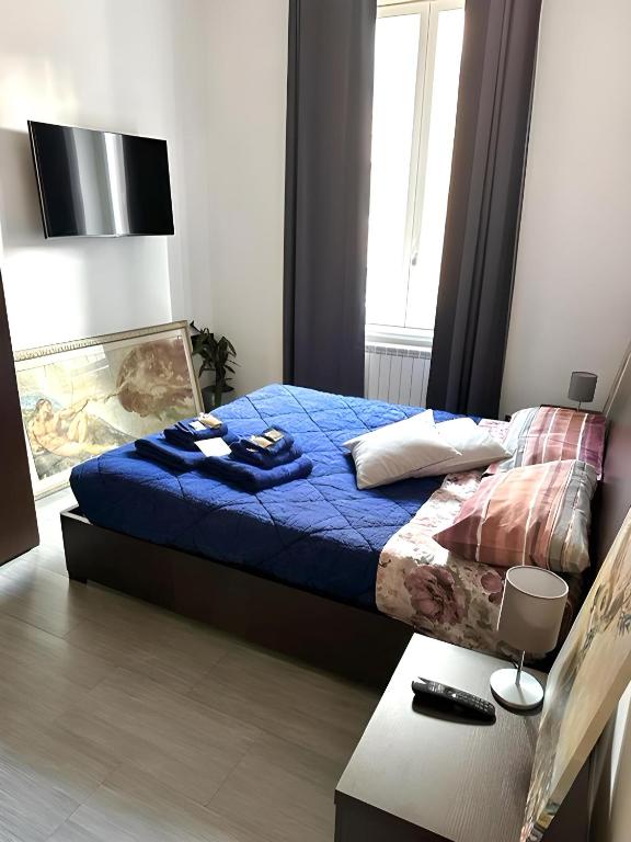 A bed or beds in a room at Ami House Roma