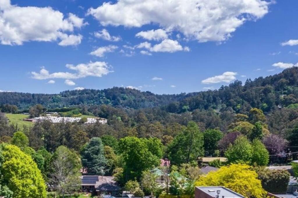 an aerial view of a town in the mountains with trees at Centre of town - Great views in Monbulk