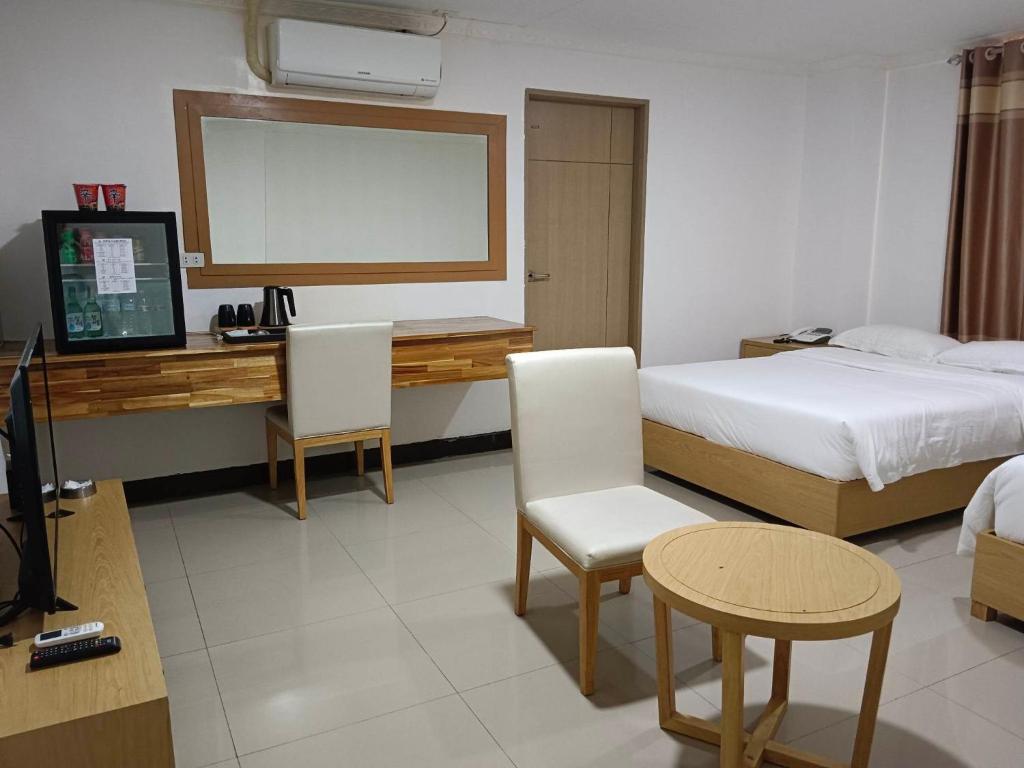 Postel nebo postele na pokoji v ubytování PUNTA CLARK HOTEL