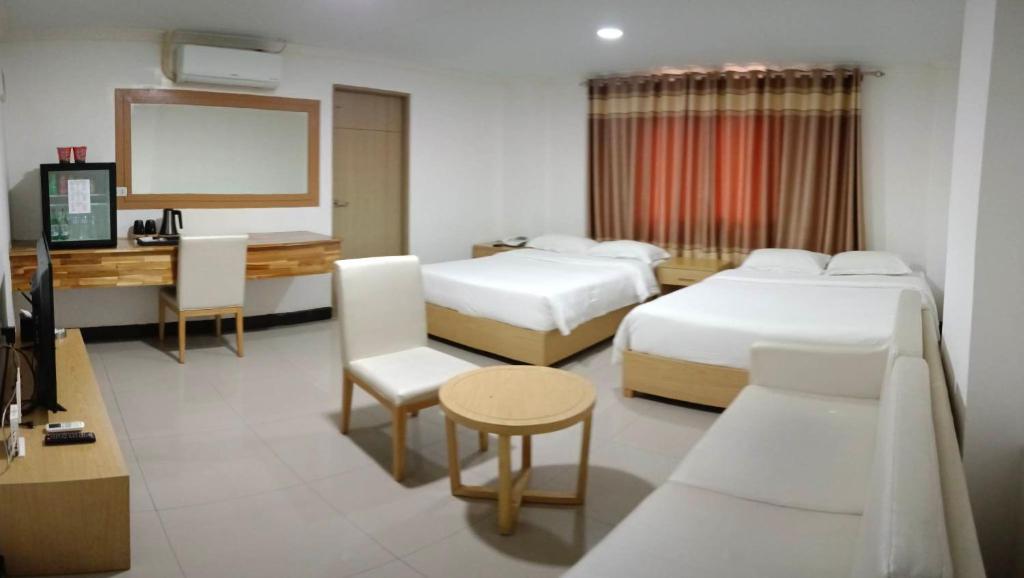 Postel nebo postele na pokoji v ubytování PUNTA CLARK HOTEL