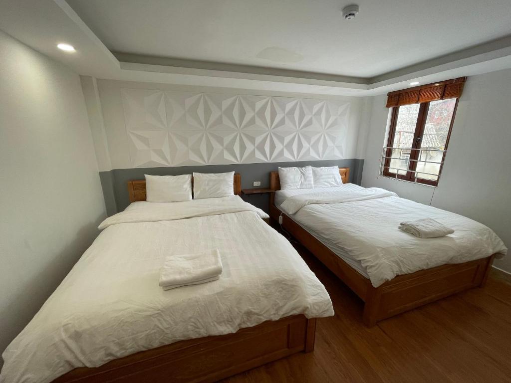 Postel nebo postele na pokoji v ubytování Flaco Hostel Sapa
