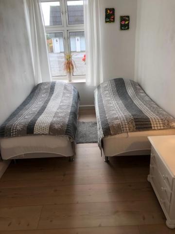 Postel nebo postele na pokoji v ubytování Bulagergaard
