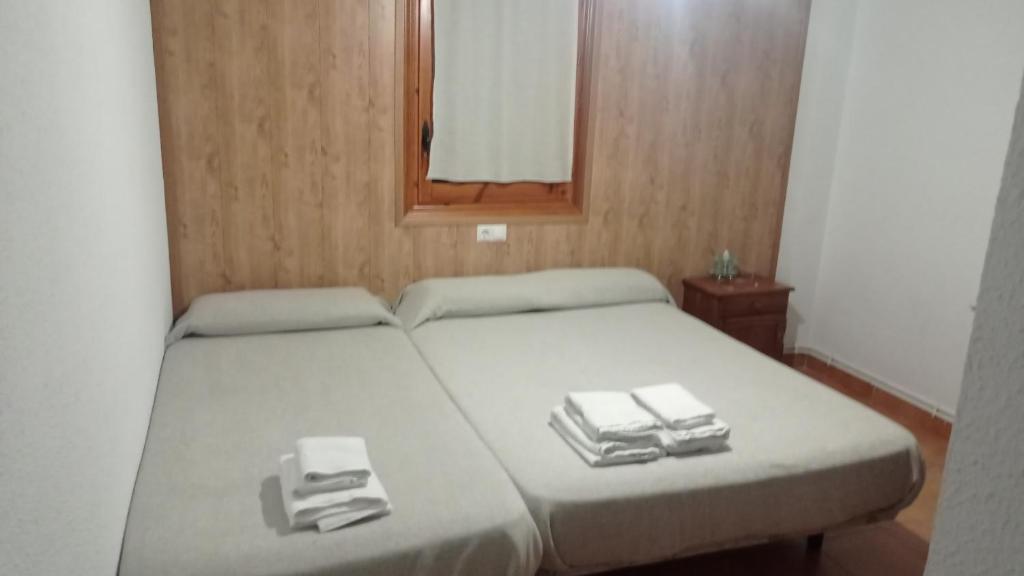 Letto o letti in una camera di La Coma