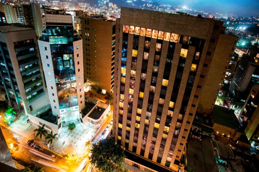 an aerial view of a city at night at JW Marriott Caracas in Caracas