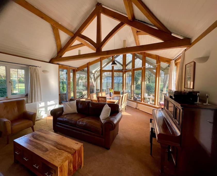 a living room with a couch and a table at Entire country farmhouse in Cardiff