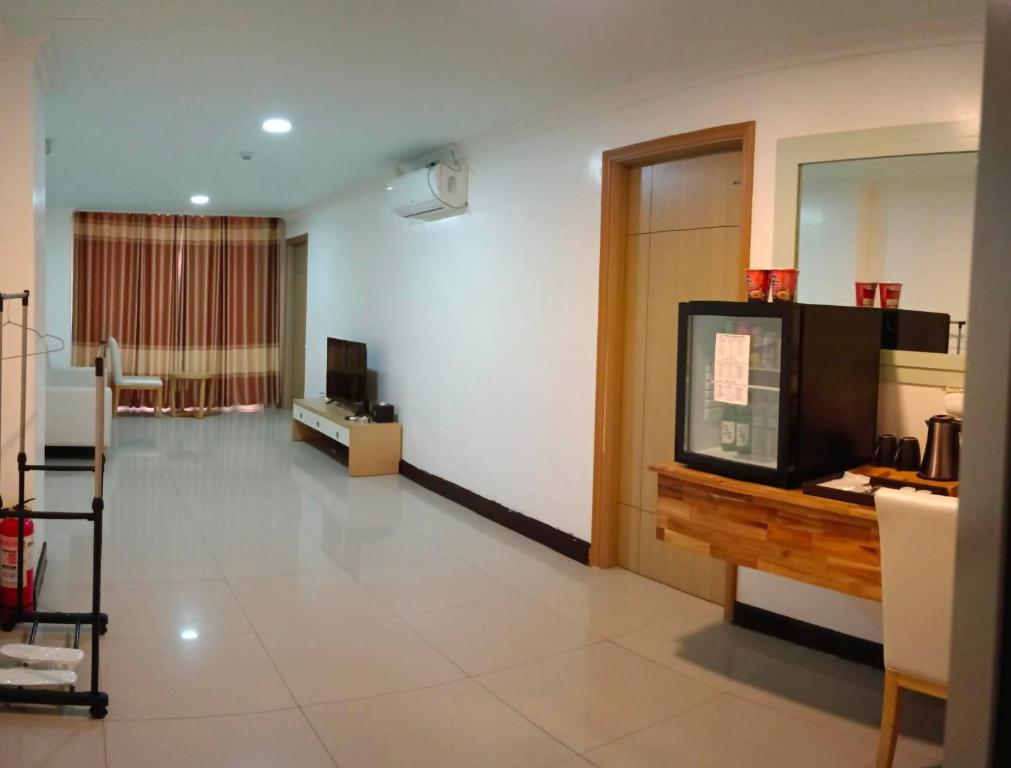TV a/nebo společenská místnost v ubytování PUNTA CLARK HOTEL