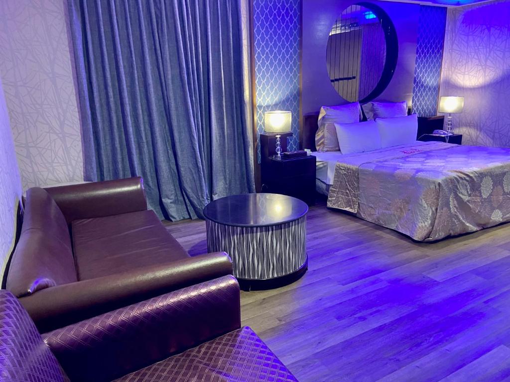 Postel nebo postele na pokoji v ubytování Huang Xing Motel