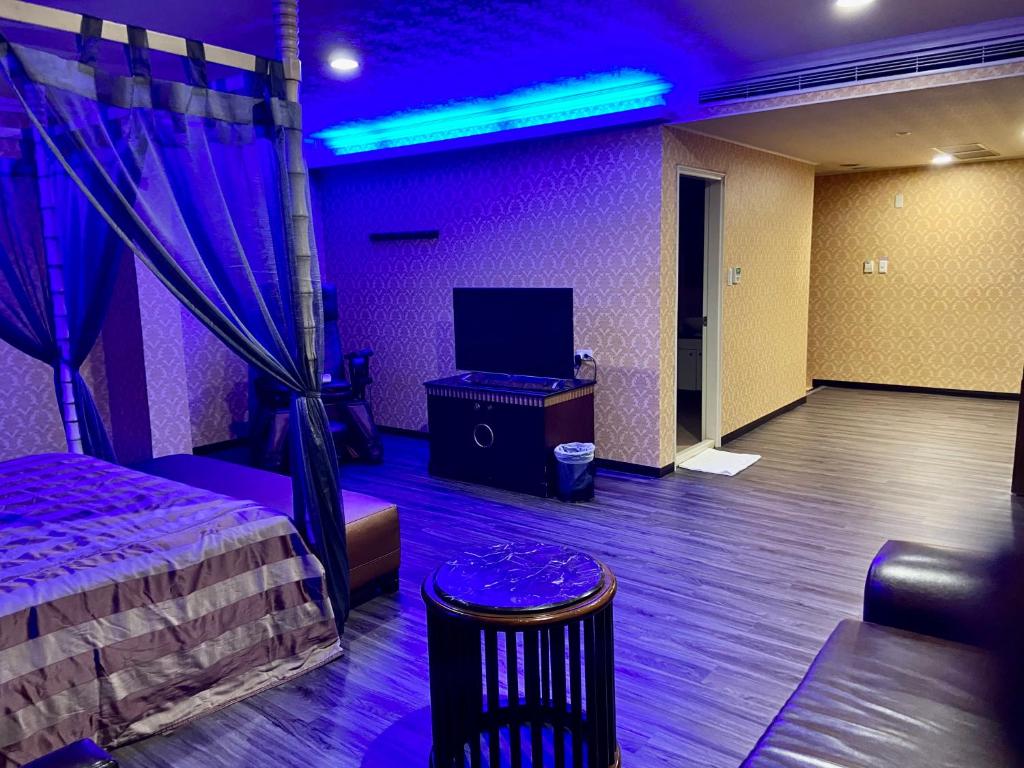 TV a/nebo společenská místnost v ubytování Huang Xing Motel