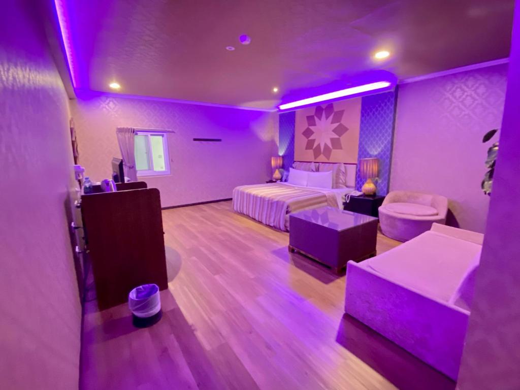 Postel nebo postele na pokoji v ubytování Huang Xing Motel