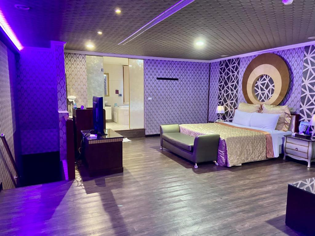 Postel nebo postele na pokoji v ubytování Huang Xing Motel