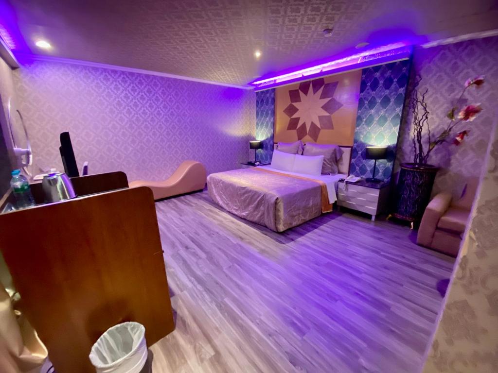 Postel nebo postele na pokoji v ubytování Huang Xing Motel