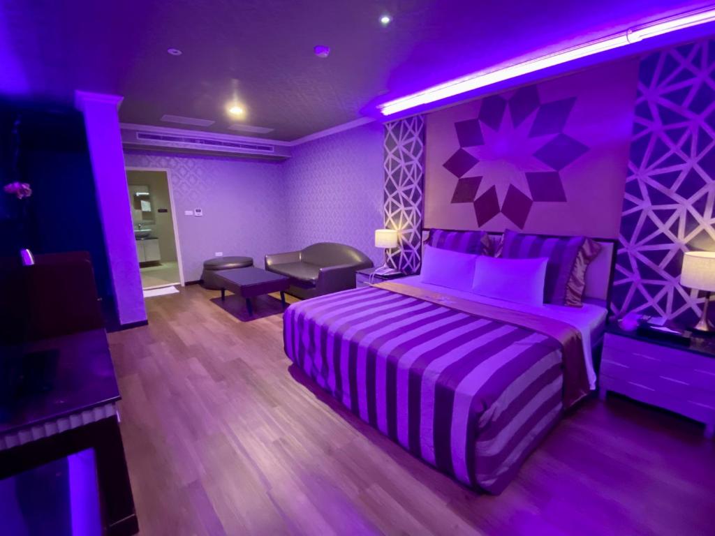 Postel nebo postele na pokoji v ubytování Huang Xing Motel