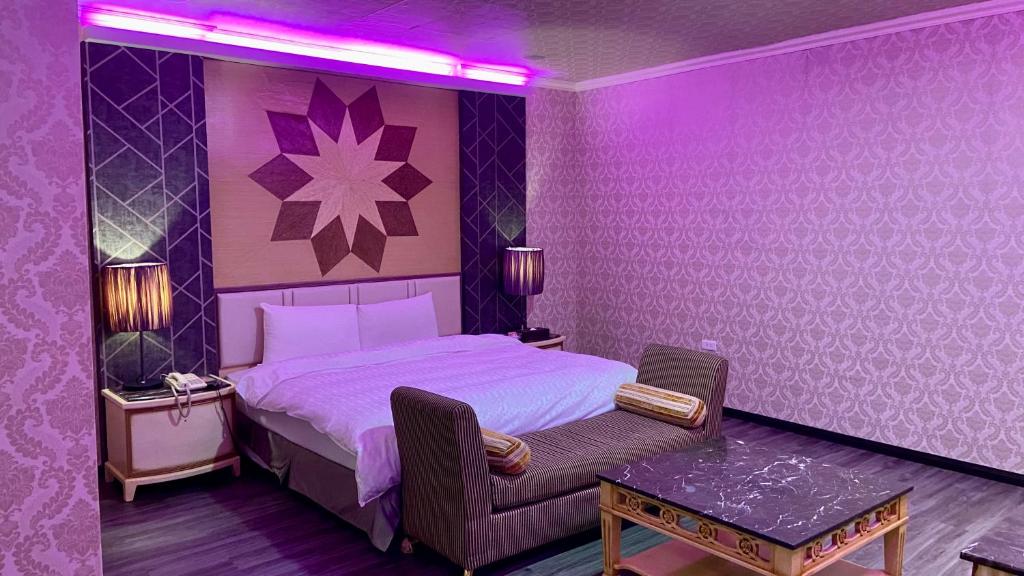 Postel nebo postele na pokoji v ubytování Huang Xing Motel