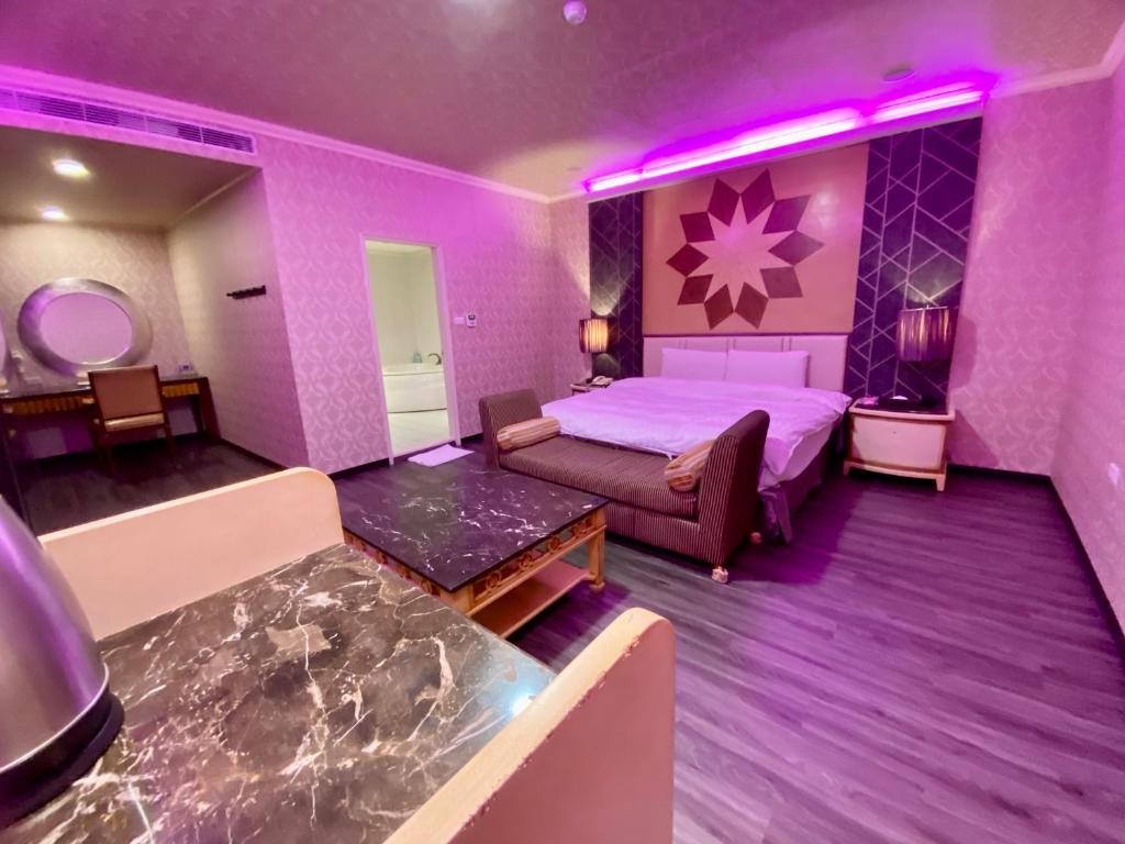 Postel nebo postele na pokoji v ubytování Huang Xing Motel