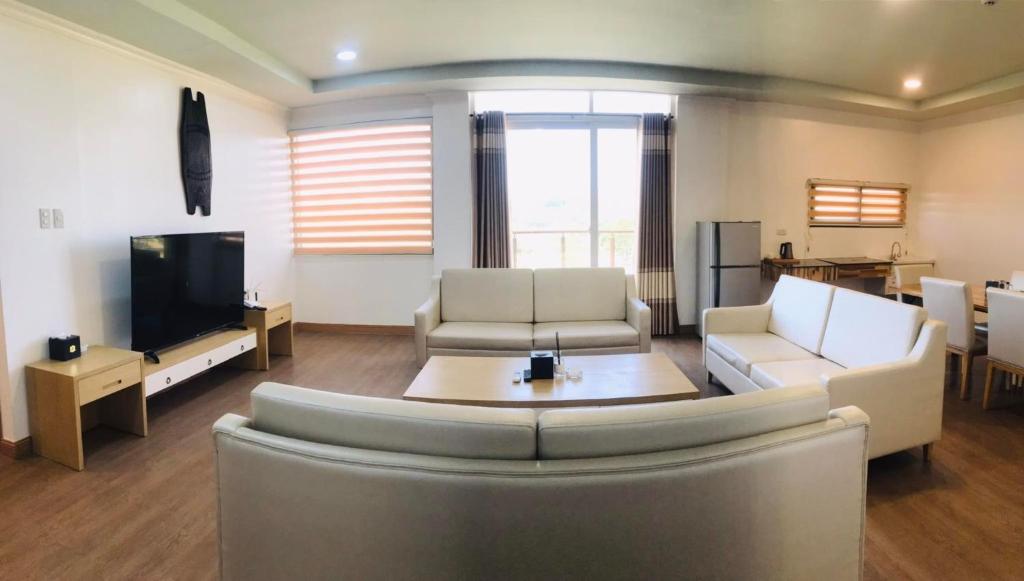 TV a/nebo společenská místnost v ubytování PUNTA CLARK HOTEL