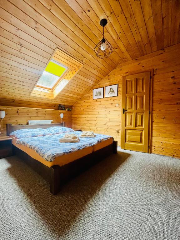 Postel nebo postele na pokoji v ubytování Pension Grizzly