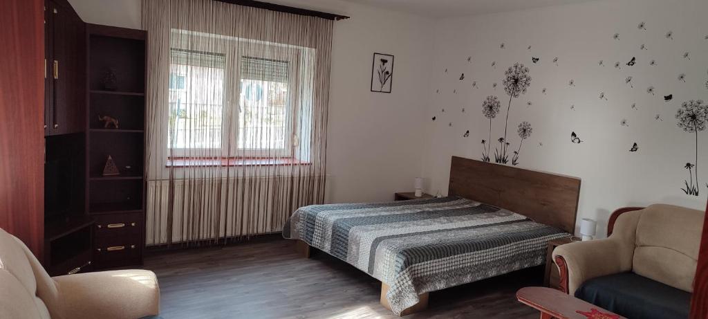 Posteľ alebo postele v izbe v ubytovaní Lugas Apartman
