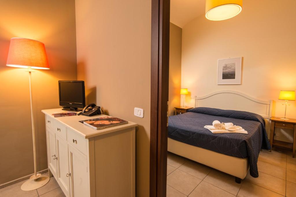 Postel nebo postele na pokoji v ubytování Santa Giulia Hotel e Residence Torino
