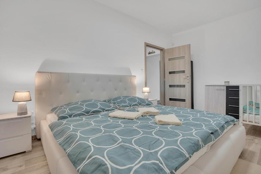 Postel nebo postele na pokoji v ubytování Apartmány Čtyřlístek