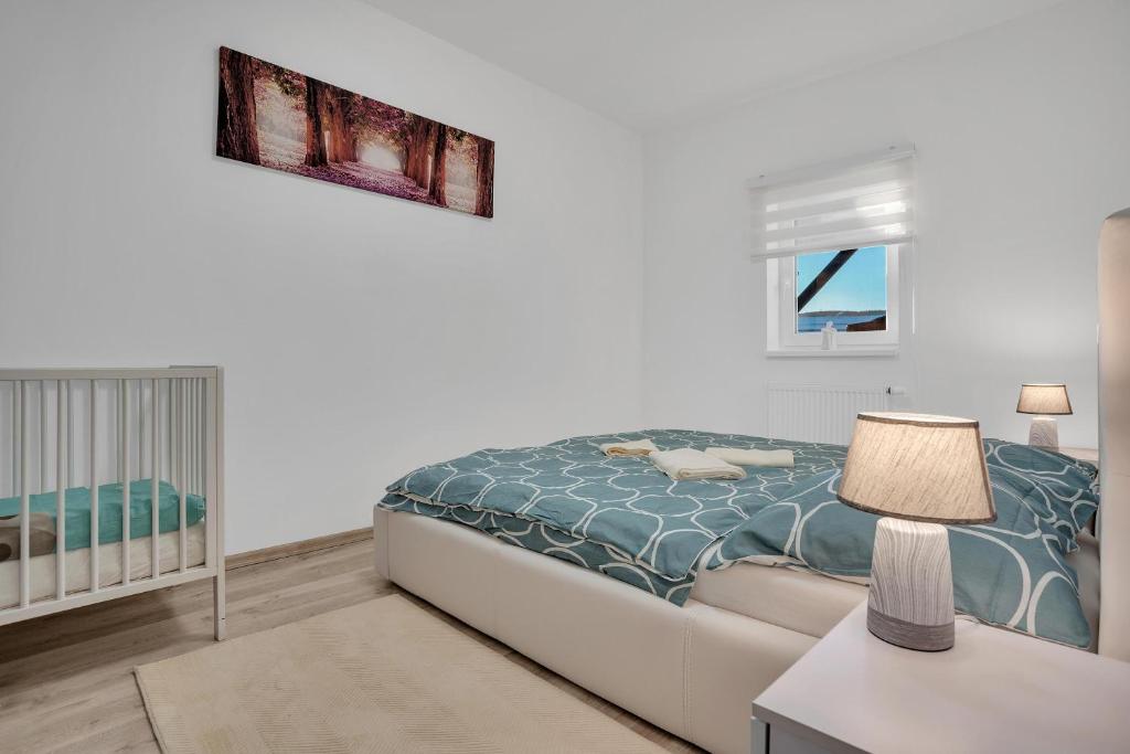 Postel nebo postele na pokoji v ubytování Apartmány Čtyřlístek