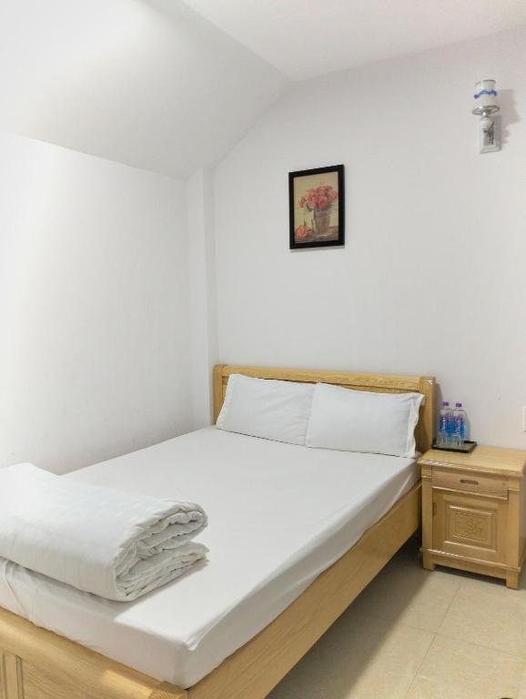 Postel nebo postele na pokoji v ubytování Daisy Dalat House