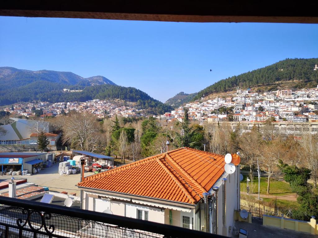 a view from the balcony of a building with an orange roof at Xanthi's House in Xanthi