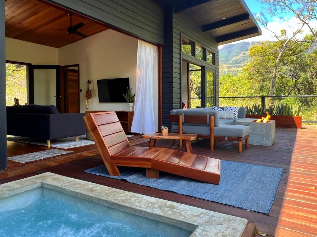 a patio with a swimming pool and a living room at Finca Panda in Boquete