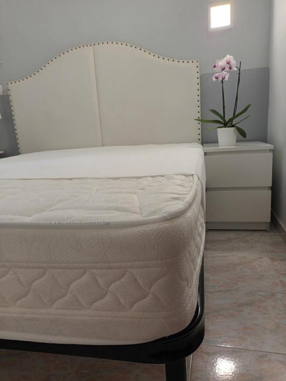 Postel nebo postele na pokoji v ubytování Hotel Castelfidardo