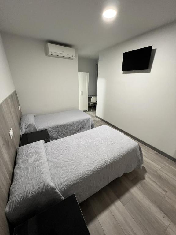 Postel nebo postele na pokoji v ubytování Hospederia del Pilar
