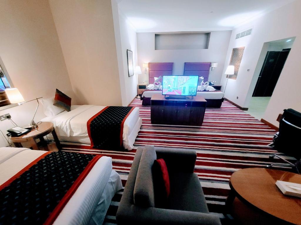 TV a/nebo společenská místnost v ubytování Wonder Palace Hotel Qatar
