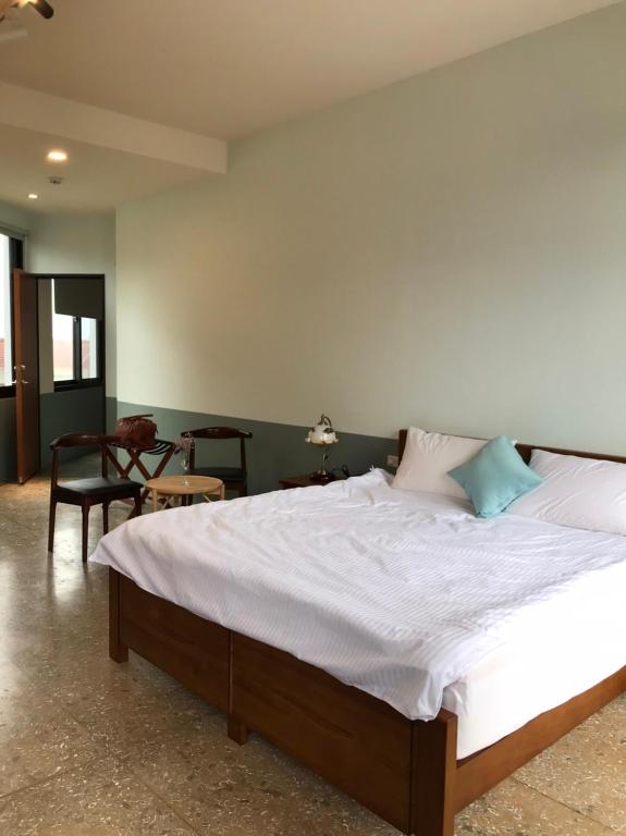 Postel nebo postele na pokoji v ubytování 九屏文旅 JP guesthouse
