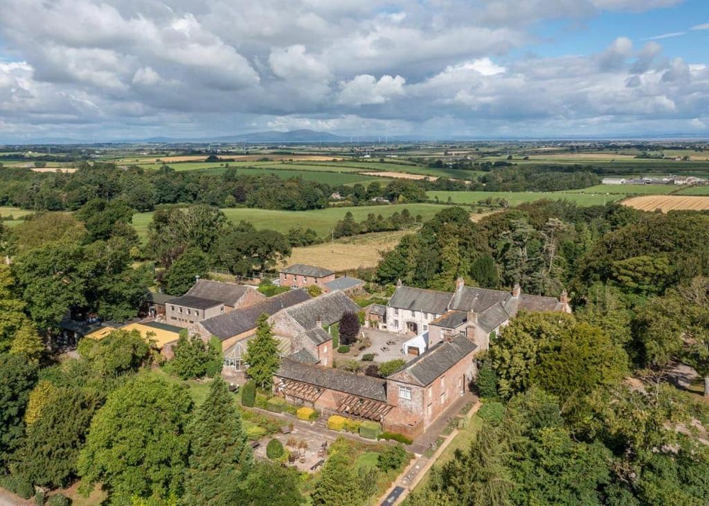 an aerial view of an estate with trees and houses at Blaithwaite Country House Estate in Wigton