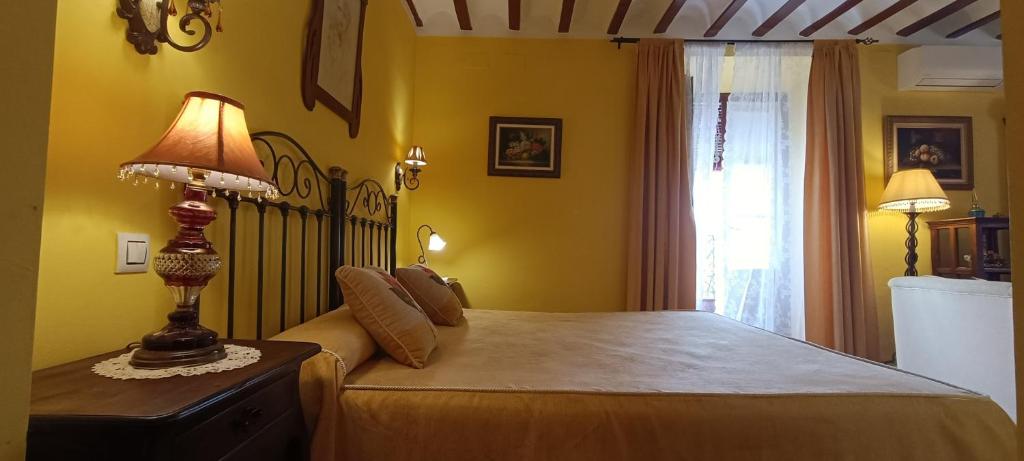 Postel nebo postele na pokoji v ubytování Hotel Rural Posada Los Caballeros