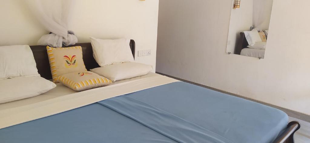 Postel nebo postele na pokoji v ubytování Ella value village