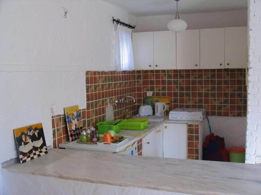 A kitchen or kitchenette at Pasha Apart Hotel
