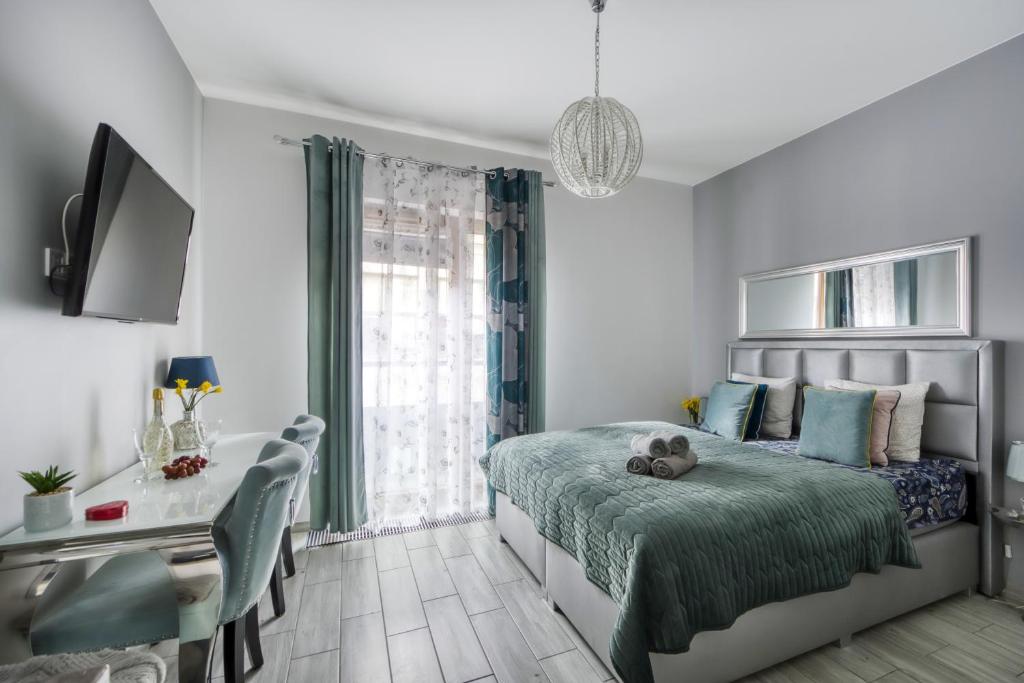 Posteľ alebo postele v izbe v ubytovaní Aparthotel Pawia Deluxe