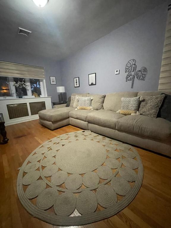 a living room with a couch and a table at Verdana Rental NJ in North Bergen