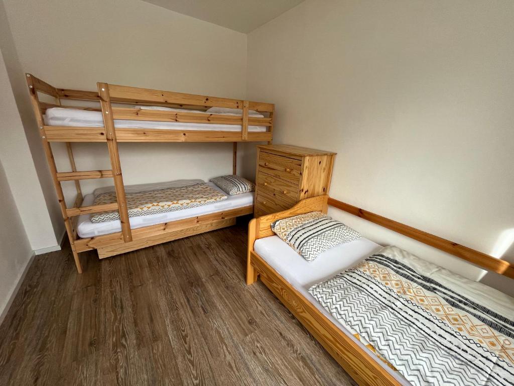 Posteľ alebo postele v izbe v ubytovaní Apartmány Josefáč se saunou