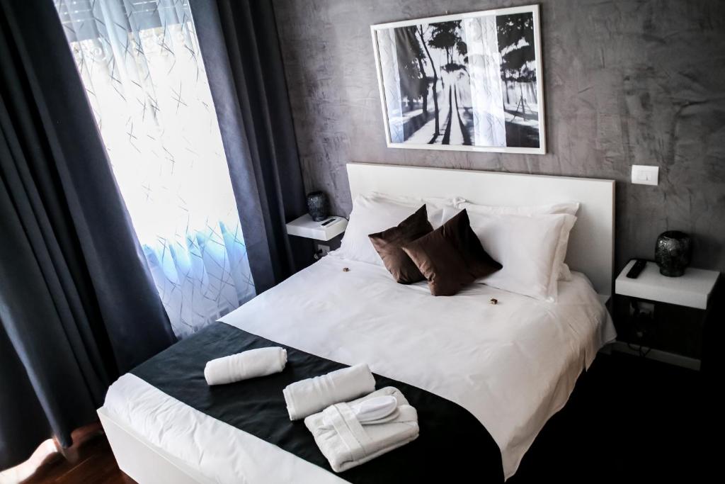 Postel nebo postele na pokoji v ubytování Relais Circo Massimo