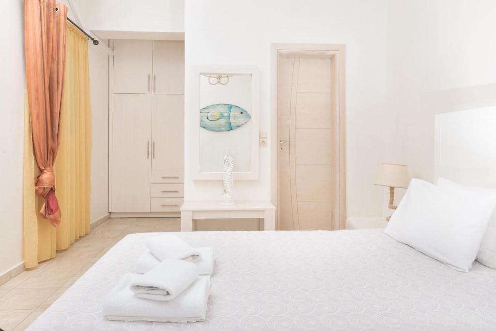 Postel nebo postele na pokoji v ubytování Hotel Sunshine Matala