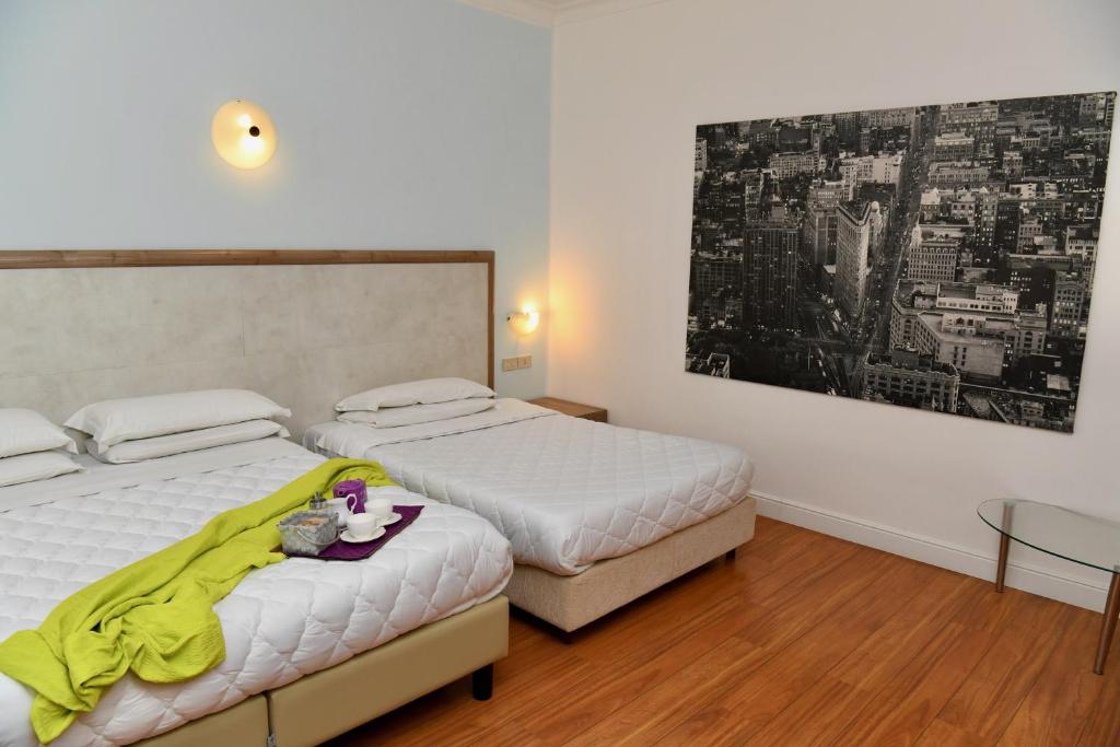 Postel nebo postele na pokoji v ubytování Hotel Anacapri