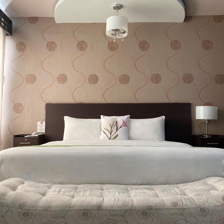 Postel nebo postele na pokoji v ubytování Hotel Ceibo Dorado