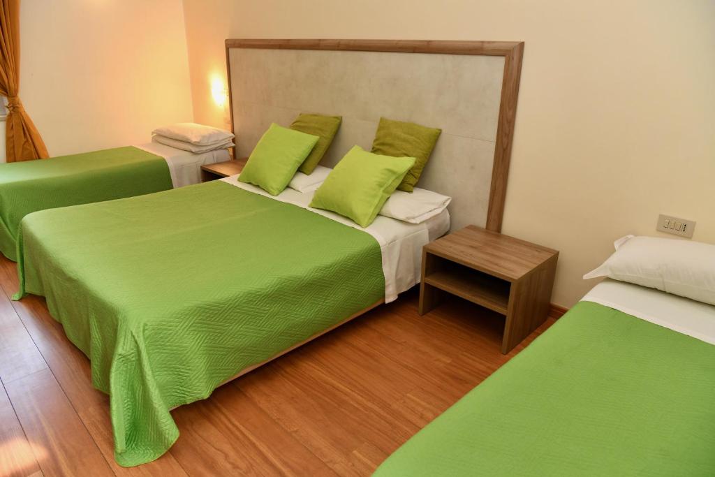 Postel nebo postele na pokoji v ubytování Hotel Anacapri