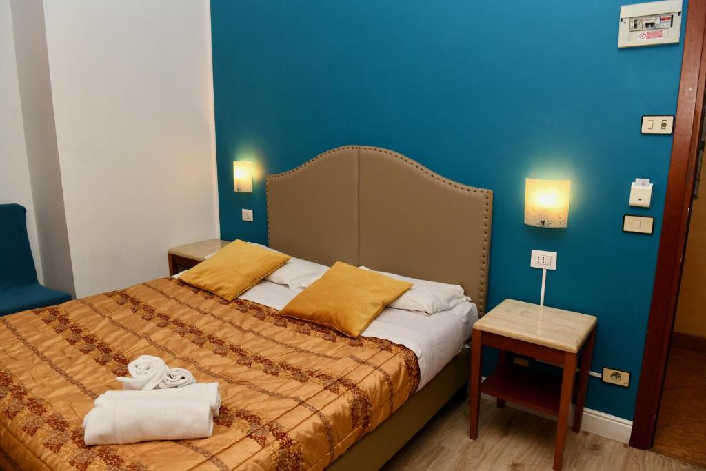 Postel nebo postele na pokoji v ubytování Hotel Anacapri
