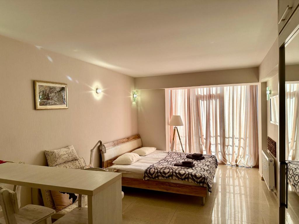 Postel nebo postele na pokoji v ubytování Light Apartments
